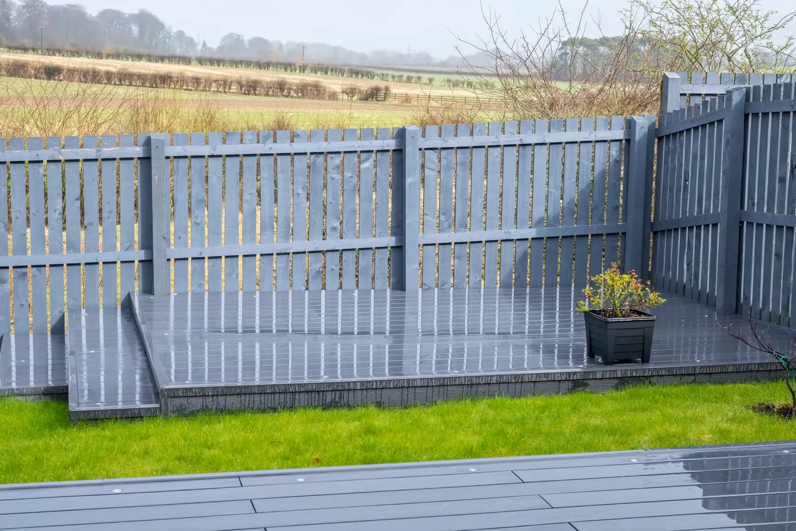 Grey composite decking in a garden