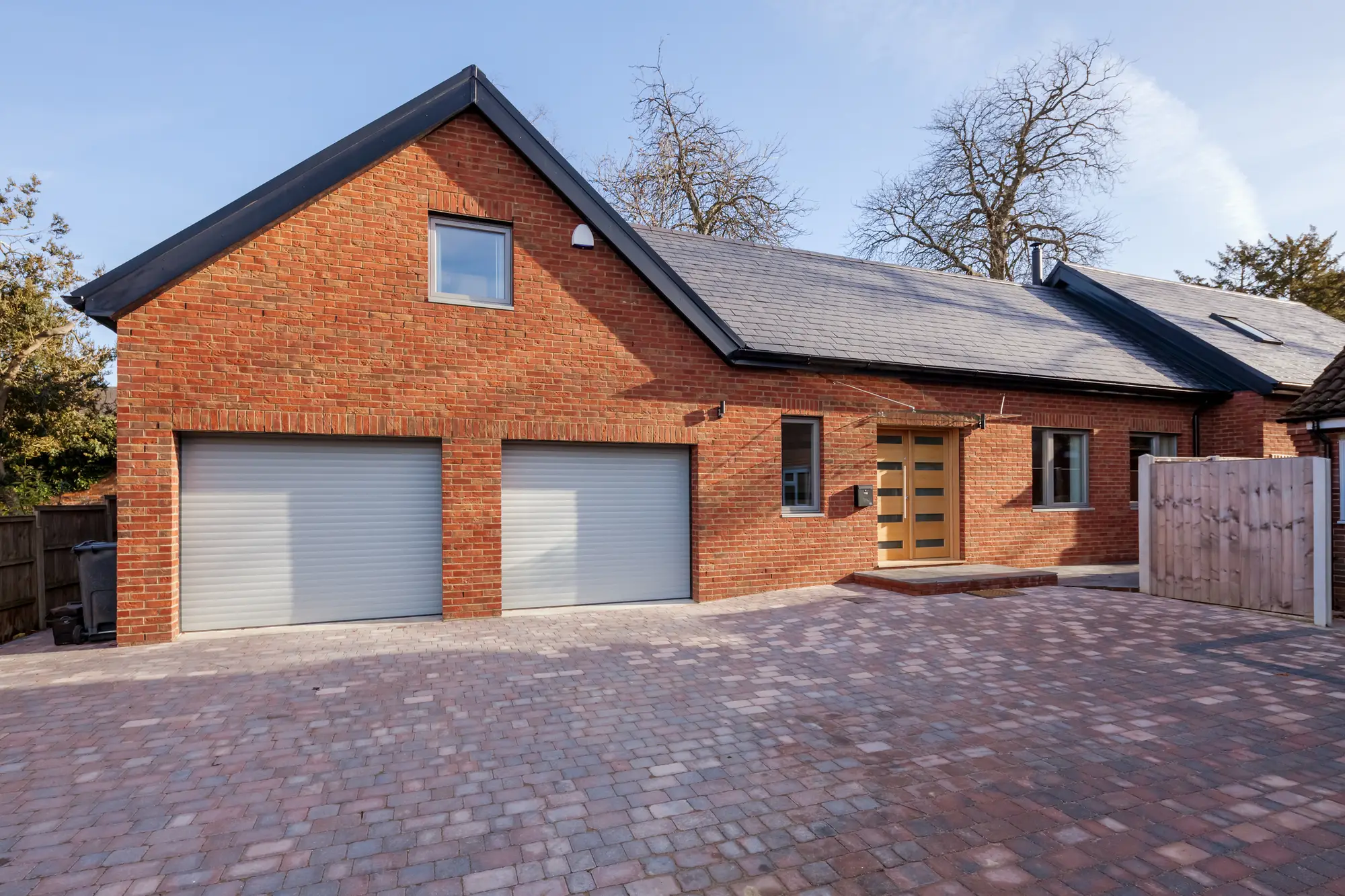 Brindle block paved driveway in front of a double garage