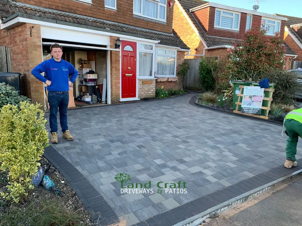 Charcoal block paved driveway with a silver border