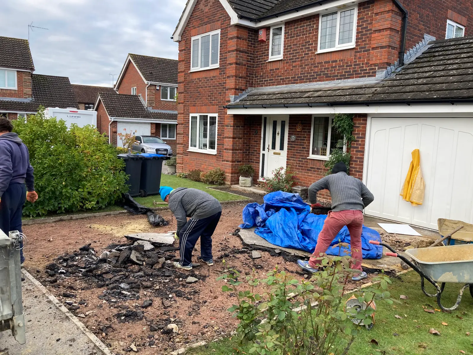 The team clearing a front garden