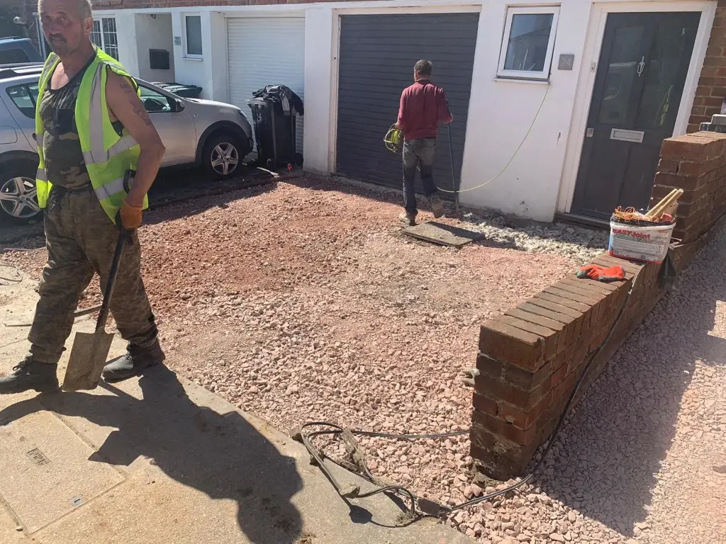 Sub-base being compacted for a new driveway