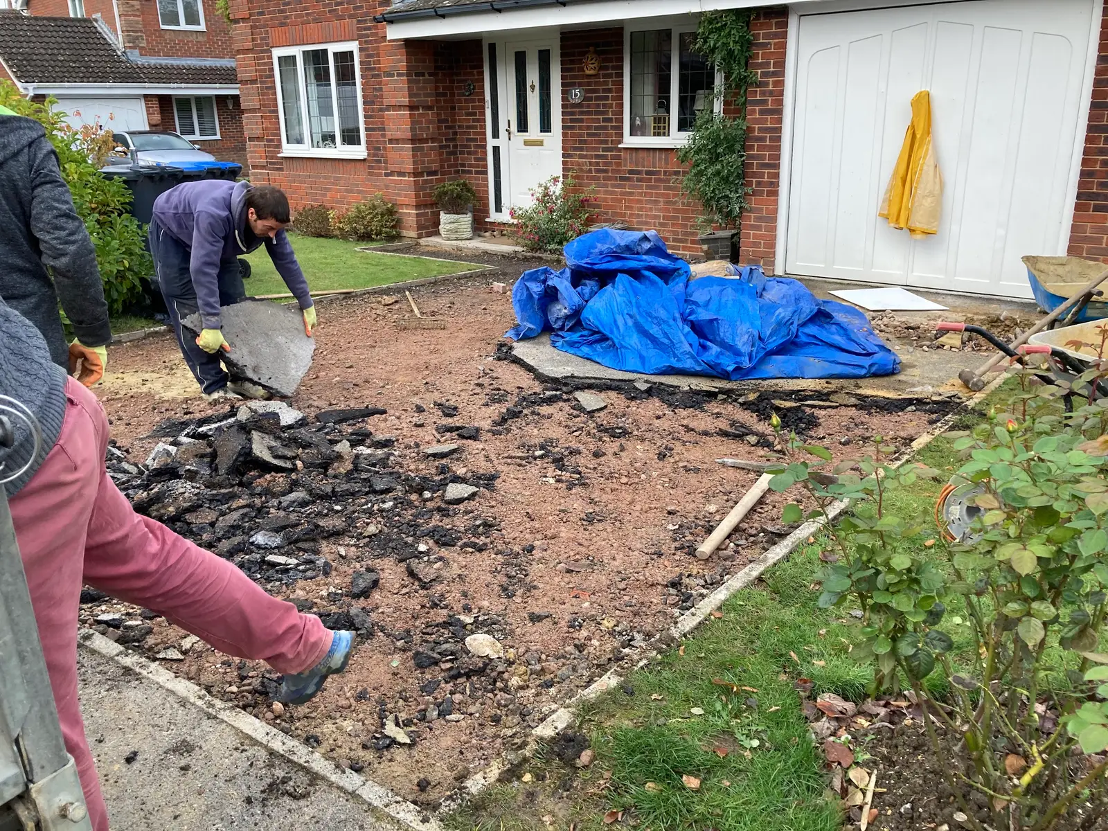 The team lifting an old front garden surface