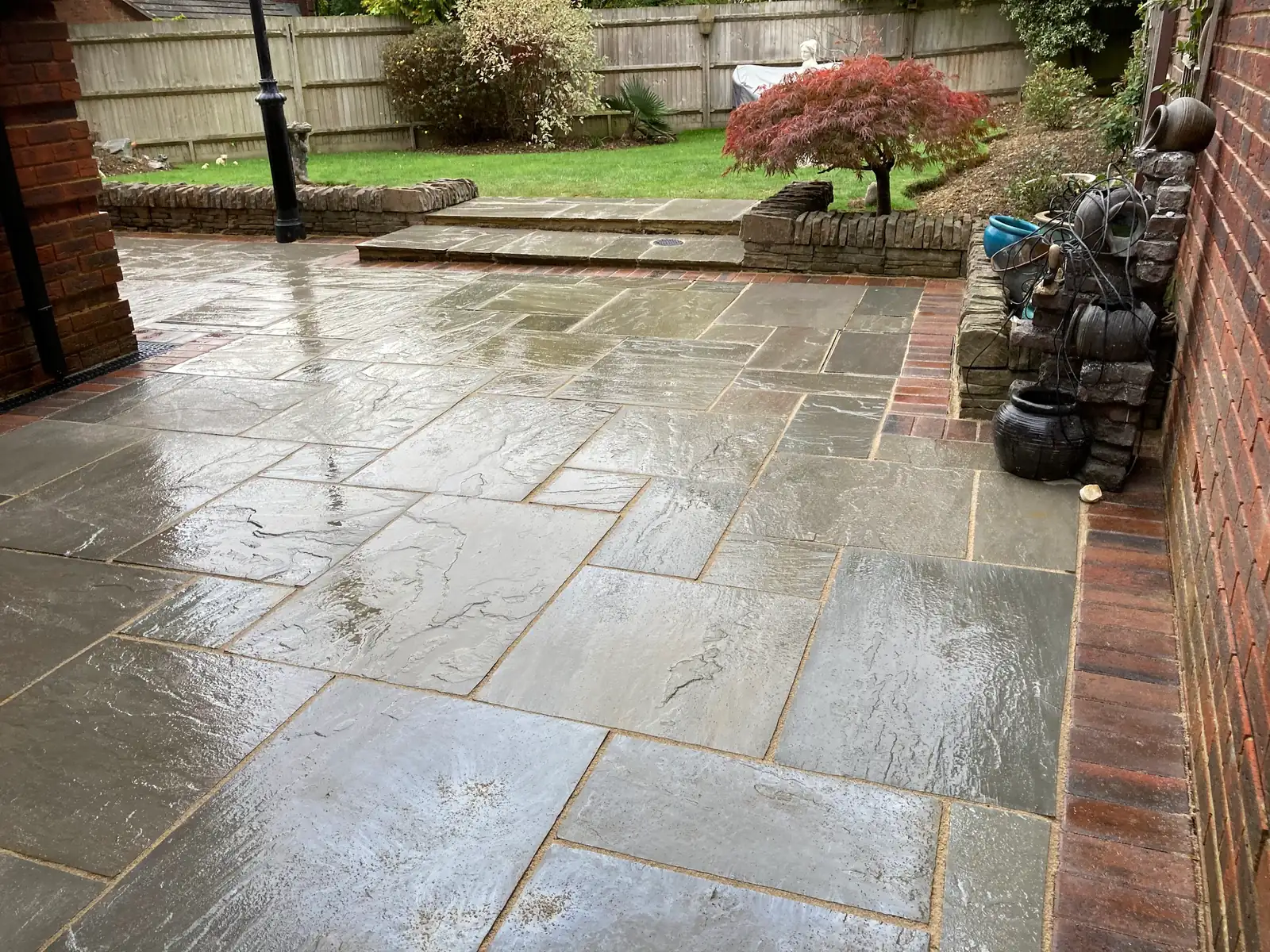 Natural sandstone patio laid by Landcraft Drives & Patios