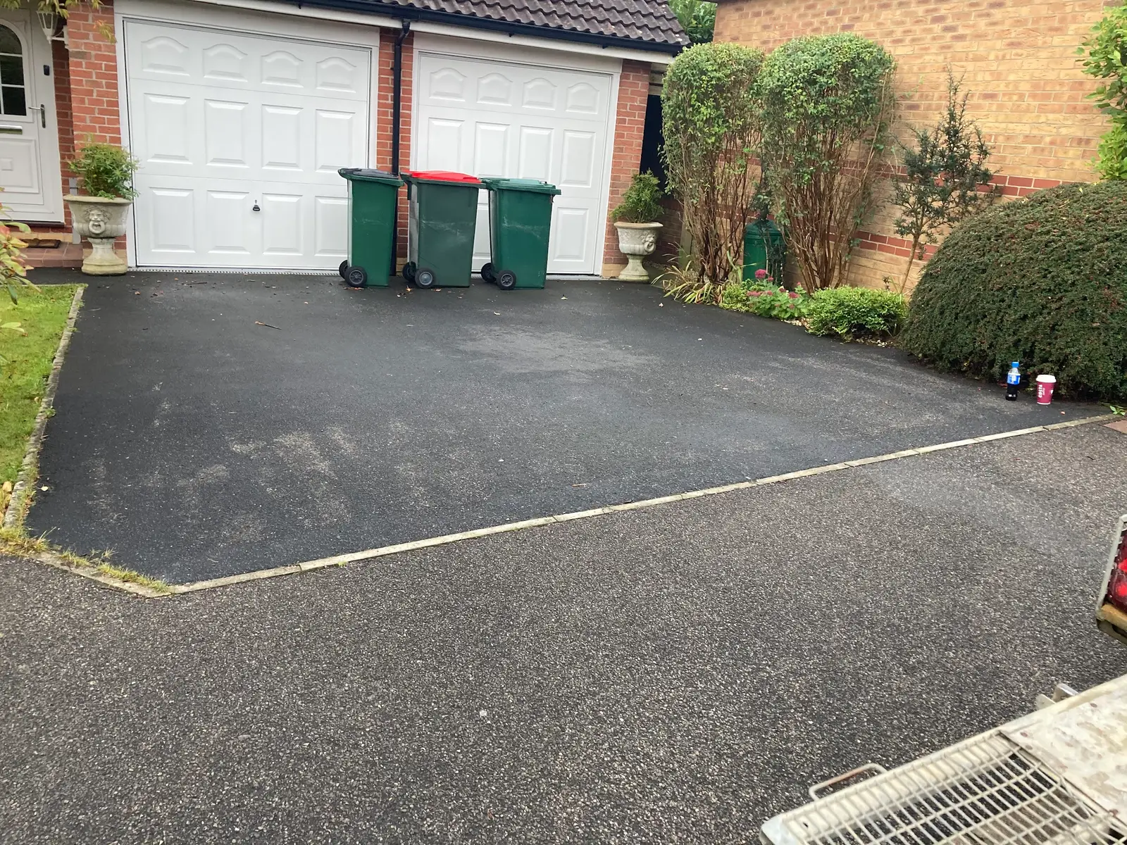 Tarmac driveway in front of a double garage